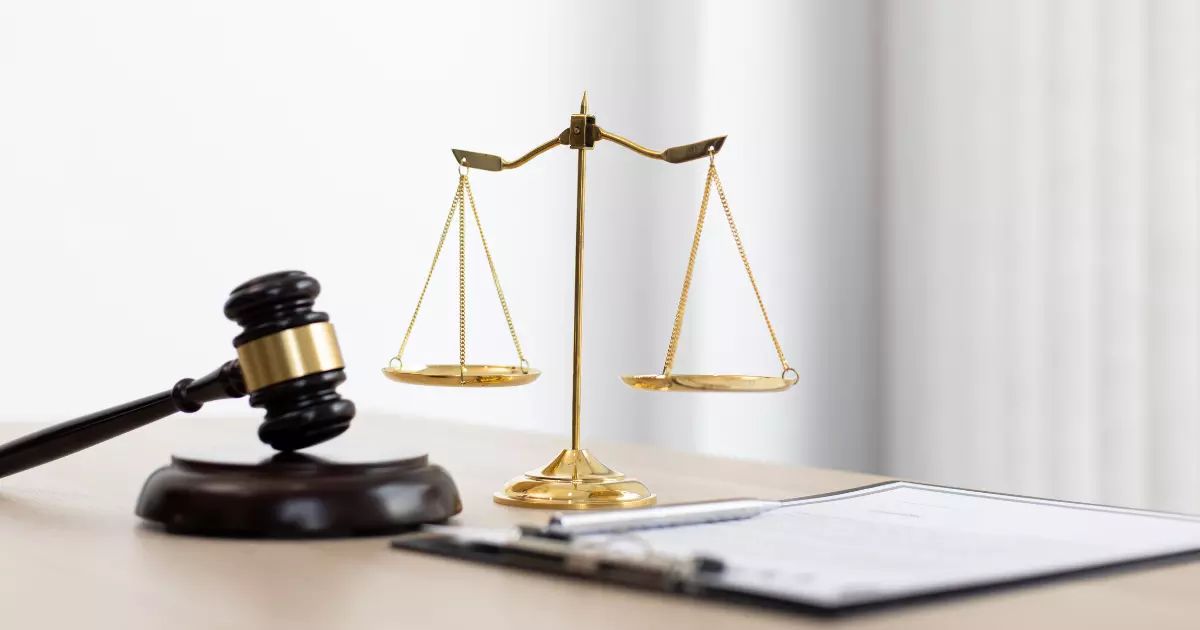 A gavel and scales on a table