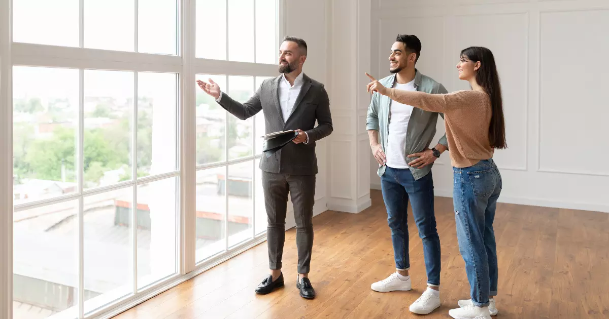 A group of people standing in a room 