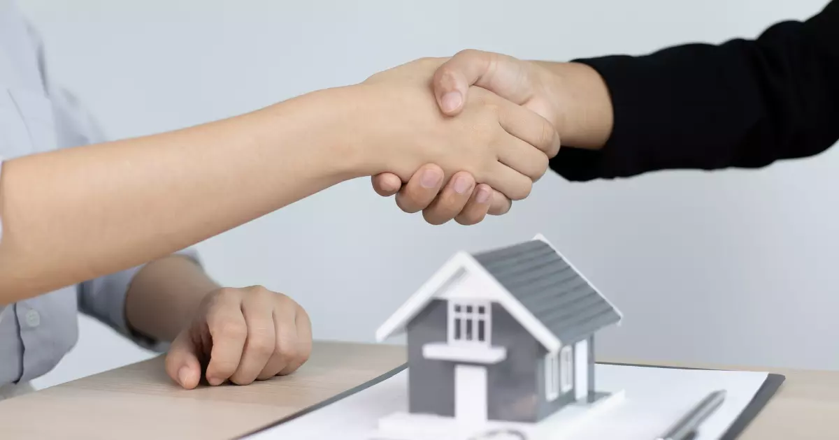 Handshake symbolizing property management service deal